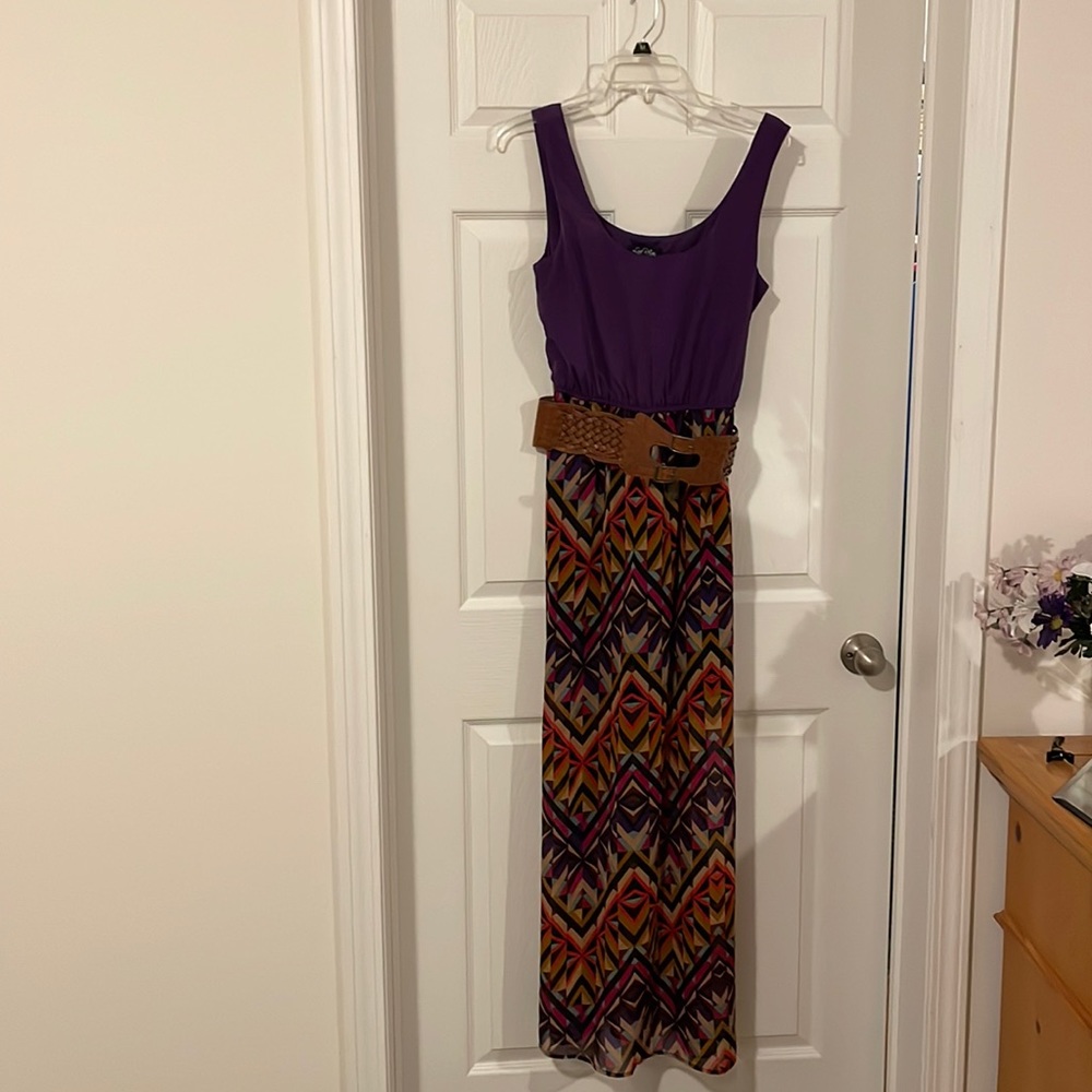 Purple dress with multi colors on bottom with belt.